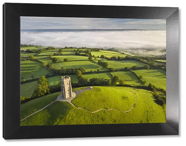 Early morning mists at St Michaels Tower on Glastonbury Tor in Somerset, England. Autumn (September) 2020