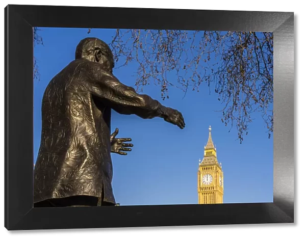 Nelson Mandela statue on Parliament square and Big Ben, also known as Elizabeth Tower. Part of the Houses of Parliament and a Unesco World Heritage site, London, England, UK
