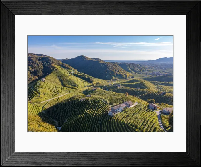 Framed Print : Valdobbiadene, Prosecco sparkling white wine region. Vineyards on the road and hills from above. Veneto, Italy