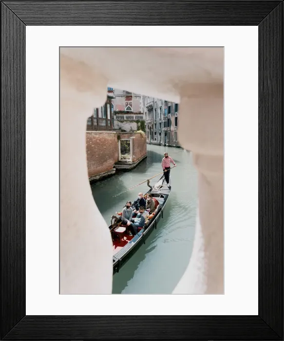 Framed Print : gondalier row his traditional boat in Venice canal, Veneto, Italy Framed Print : gondalier row his traditional boat in Venice canal, Veneto, Italy