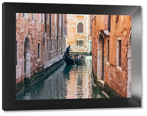 Gondolier and gondola in Cananregio, Venice, Veneto, Italy