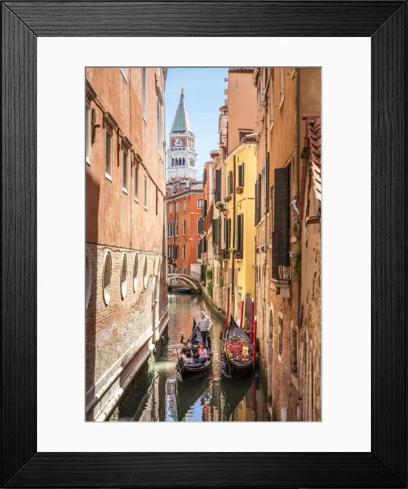 Framed Print : Gondolier and gondola in San Marco, tower on background. Venice, Veneto, Italy Framed Print : Gondolier and gondola in San Marco, tower on background. Venice, Veneto, Italy