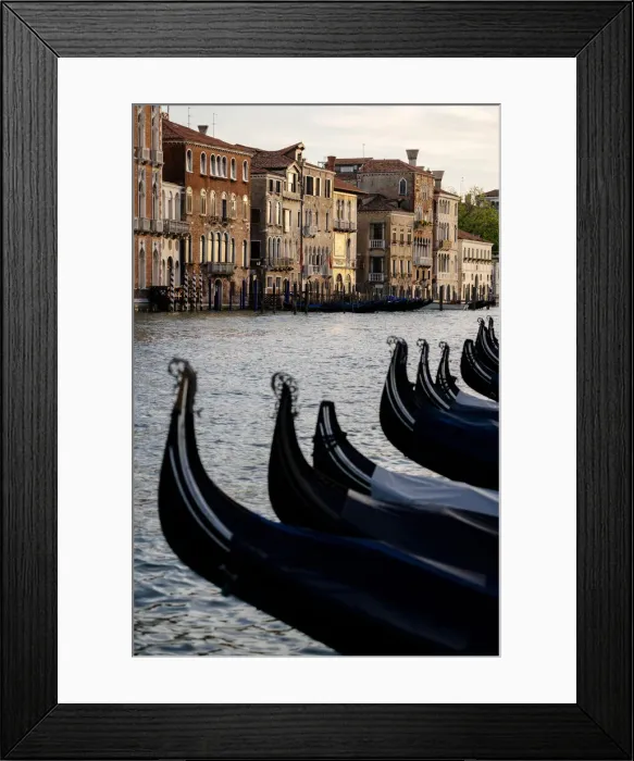 Framed Print : Venice, Veneto, Italy. Gondolas bows and Grand Canal at sunset