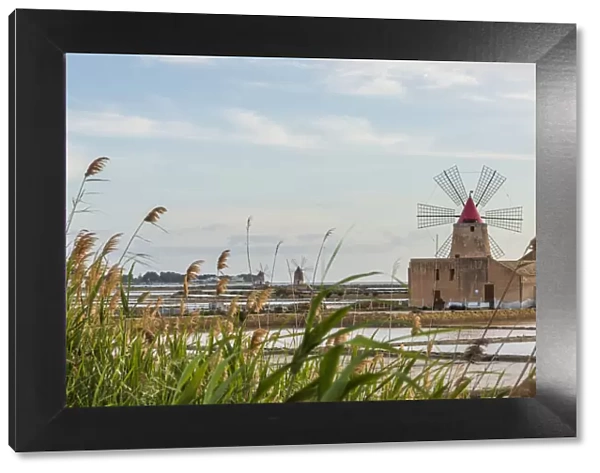 europe, Italy, Sicily. Marsala the salt flats with the ancient wind mill
