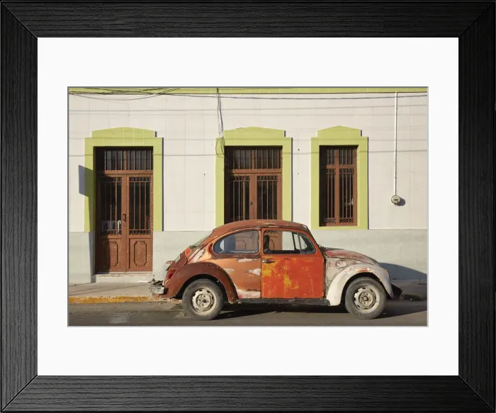 Framed Print : A vintage Volkswagen Beetle in front of a house in Merida, Yucatan, Mexico