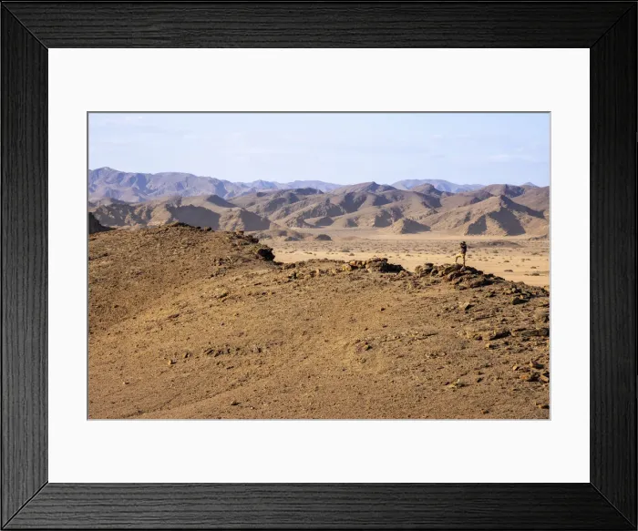 Framed Print : Man on a mountain, Skeleton Coast National Park, Namibia Framed Print : Man on a mountain, Skeleton Coast National Park, Namibia