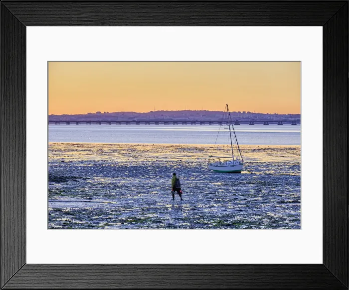 Framed Print : A shellfisherman walks in low tide along the Tagus river. Alcochete, Portugal Framed Print : A shellfisherman walks in low tide along the Tagus river. Alcochete, Portugal