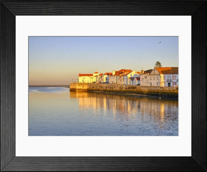 Framed Print : The traditional fishing village of Alcochete at sunset, spreading along the river Tagus and facing Lisbon, on the other bank of the river. Portugal Framed Print : The traditional fishing village of Alcochete at sunset, spreading along the river Tagus and facing Lisbon, on the other bank of the river. Portugal