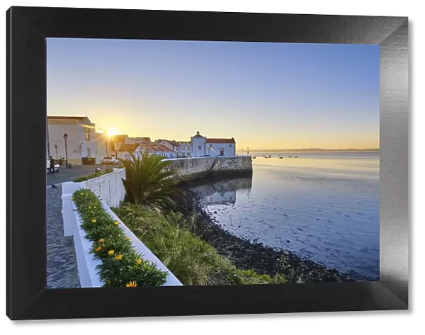 The traditional fishing village of Alcochete at sunset, spreading along the river Tagus and facing Lisbon, on the other bank of the river. Portugal