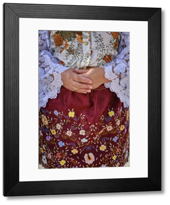 Framed Print : Detail of the traditional outfit used by Nazare women. Colourful dresses with seven skirts. Nazare, Portugal