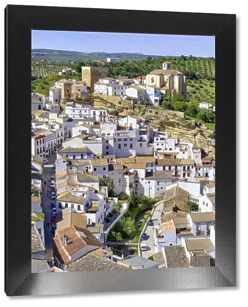 Setenil de las Bodegas with the medieval castle and the church at the hilltop, Andalucia. Spain