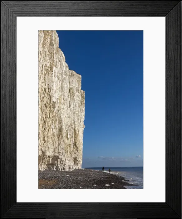 Framed Print : England, East Sussex, Eastbourne, Birling Gap, The Seven Sisters Cliffs and Beach with Couple Walking at Base of Cliffs Framed Print : England, East Sussex, Eastbourne, Birling Gap, The Seven Sisters Cliffs and Beach with Couple Walking at Base of Cliffs