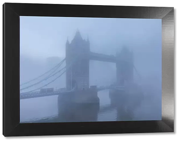 England, London, River Thames and Tower Bridge in the Early Morning Mist
