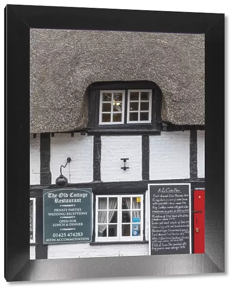 England, Hampshire, New Forest, Ringwood, 14th century Thatched Timbered Building now The Old Cottage Restaurant