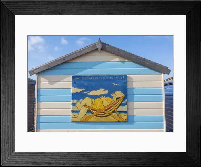 Framed Print : England, Hampshire, Hayling Island, Funny Painting of Fat Lady Asleep in Deck Chair on side of Colourful Beach Hut Framed Print : England, Hampshire, Hayling Island, Funny Painting of Fat Lady Asleep in Deck Chair on side of Colourful Beach Hut