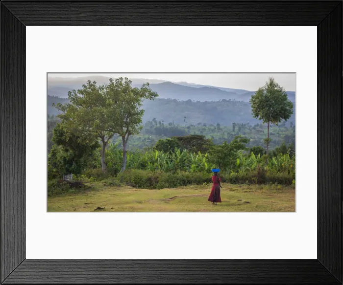 Framed Print : Africa, Uganda, Sipi Falls. Woman walking through the rural landscape Framed Print : Africa, Uganda, Sipi Falls. Woman walking through the rural landscape