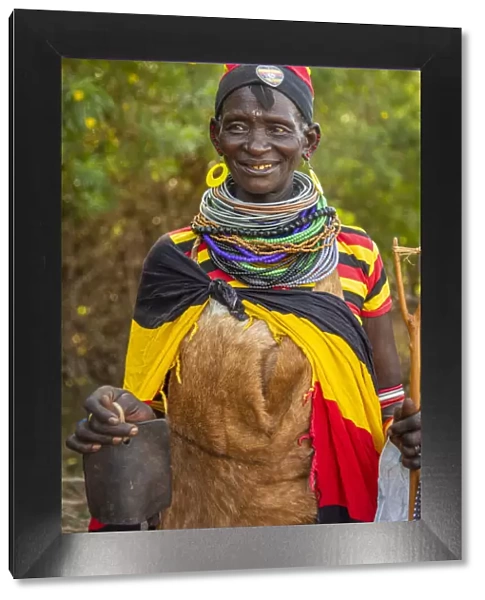 Africa, Uganda, Karamoja. Namalu. A beautiful elder woman during a wedding ceremony traditionally dressed