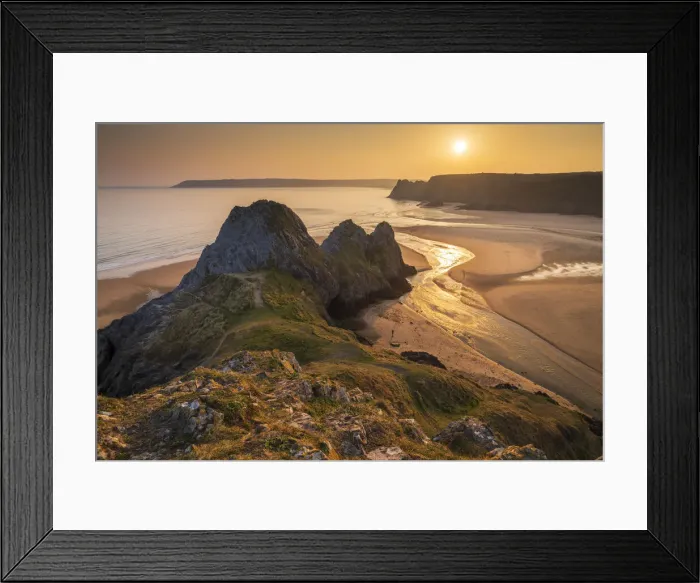Framed Print : Sunset over Three Cliffs Bay on the spectacular Gower coastline, South Wales, UK. Spring (March) 2022 Framed Print : Sunset over Three Cliffs Bay on the spectacular Gower coastline, South Wales, UK. Spring (March) 2022