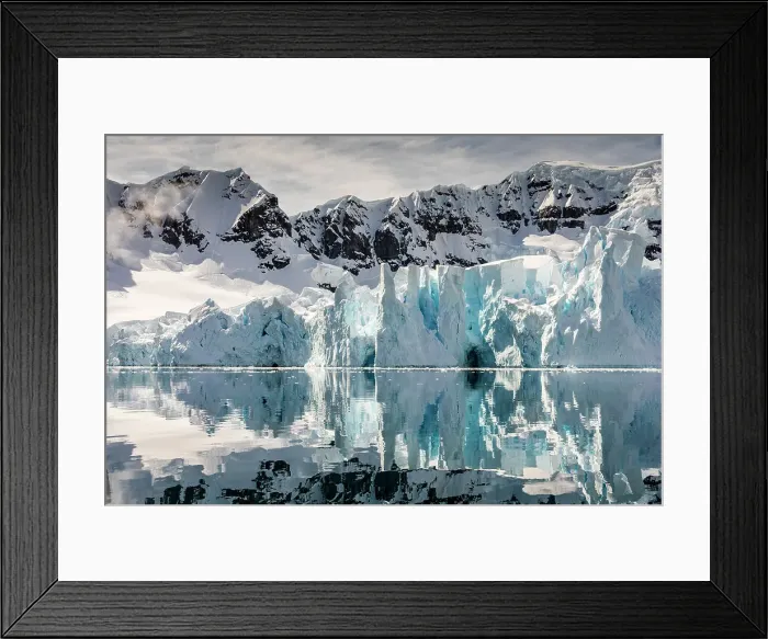 Framed Print : Mountains and glacier reflected in Paradise Harbour, Antarctica Framed Print : Mountains and glacier reflected in Paradise Harbour, Antarctica
