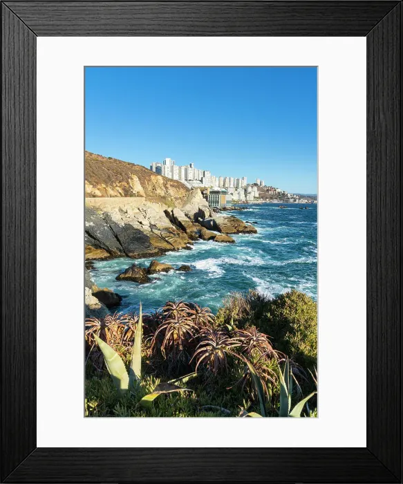 Framed Print : Rocky coastline by Roca Oceanica with distant view of residential high-rise buildings in Renaca, Concon, Valparaiso Province, Valparaiso Region, Chile Framed Print : Rocky coastline by Roca Oceanica with distant view of residential high-rise buildings in Renaca, Concon, Valparaiso Province, Valparaiso Region, Chile