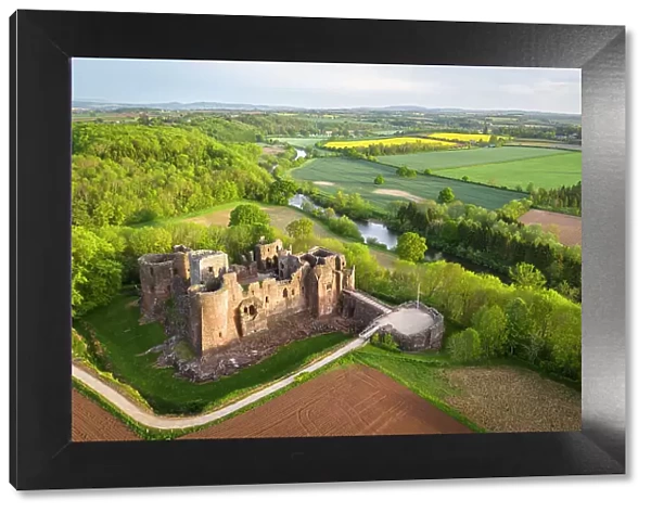 Aerial view of the medieval ruins of Goodrich Castle above the River Wye, Herefordshire, England. Spring (May) 2022