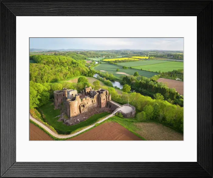 Framed Print : Aerial view of the medieval ruins of Goodrich Castle above the River Wye, Herefordshire, England. Spring (May) 2022