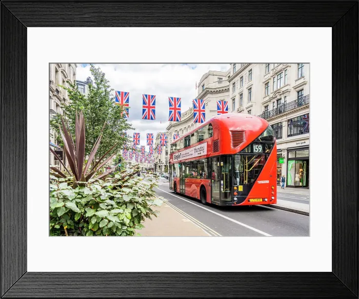 Framed Print : A red London bus and Union flags on Regent street, London, England, UK Framed Print : A red London bus and Union flags on Regent street, London, England, UK