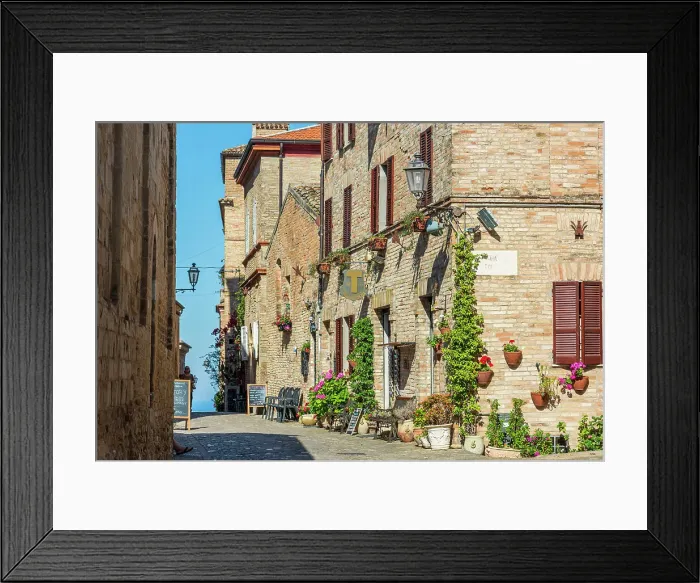 Framed Print : europe, Italy, The Marches. A narrow street in the beautiful hamlet of Torre di Palme near Fermo, with sea view