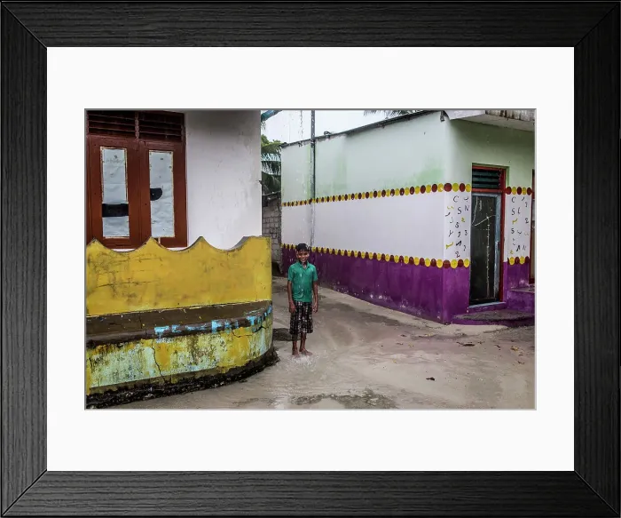 Framed Print : Maldives, Ari Atoll, Himandhoo, A young boy under the rain Framed Print : Maldives, Ari Atoll, Himandhoo, A young boy under the rain
