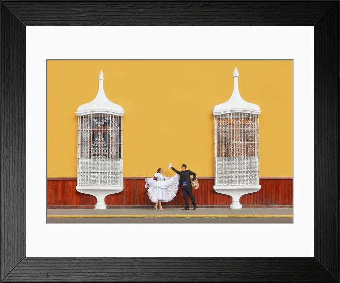 Framed Print : A couple of traditional Marinera'dancers in front of colonial architecture windows of the Plaza de Armas'in Trujillo, La Libertad, Peru. Marinera is the Peruvian National dance. (MR) Framed Print : A couple of traditional Marinera'dancers in front of colonial architecture windows of the Plaza de Armas'in Trujillo, La Libertad, Peru. Marinera is the Peruvian National dance. (MR)