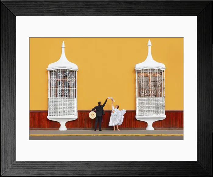 Framed Print : A couple of traditional Marinera'dancers in front of colonial architecture windows of the Plaza de Armas'in Trujillo, La Libertad, Peru. Marinera is the Peruvian National dance. (MR) Framed Print : A couple of traditional Marinera'dancers in front of colonial architecture windows of the Plaza de Armas'in Trujillo, La Libertad, Peru. Marinera is the Peruvian National dance. (MR)