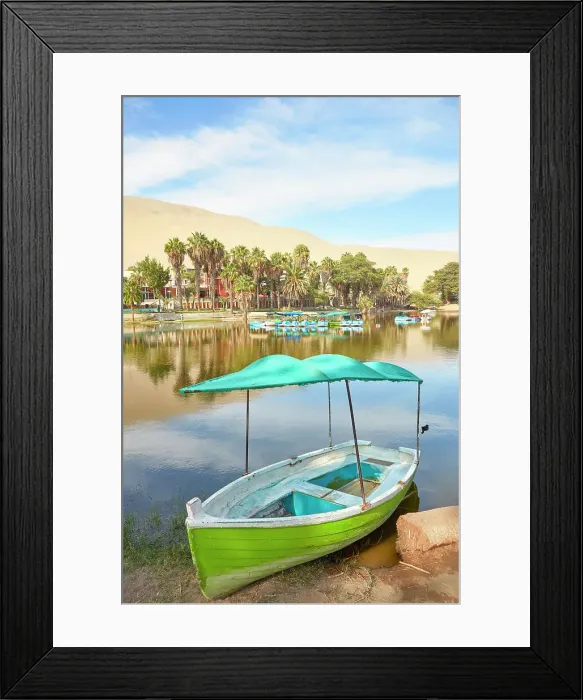 Framed Print : A wooden boat on the shore of the Huacachina Oasis, Ica, Peru Framed Print : A wooden boat on the shore of the Huacachina Oasis, Ica, Peru