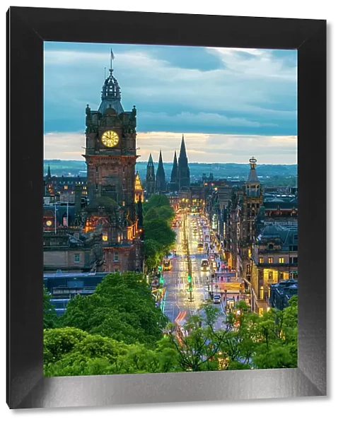 Clock tower of Balmoral Hotel, high angle view of Princes Street and St Marys Cathedral in background at dusk, UNESCO, Old Town, Edinburgh, Lothian, Scotland, UK