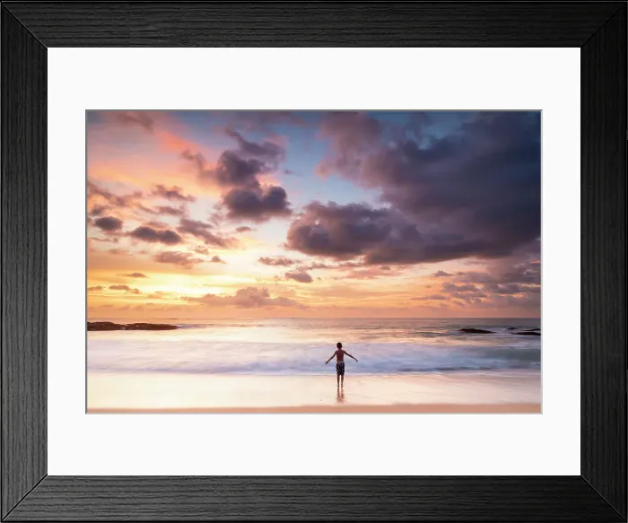 Framed Print : South East Asia, Thailand, Phang Nga Province, Khao Lak. A young boy plays on the beach at sunset. (MR)