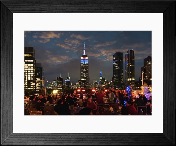 Framed Print : Manhattan rooftop, people having fun wit skyline on background at night, New York City, USA Framed Print : Manhattan rooftop, people having fun wit skyline on background at night, New York City, USA