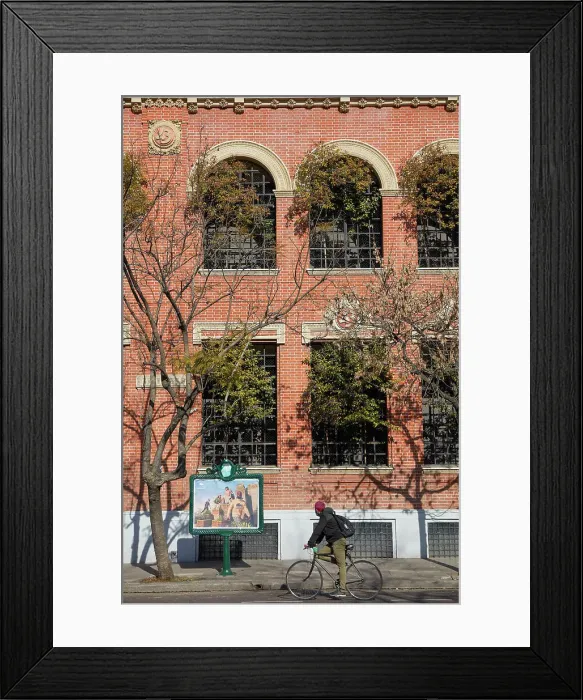 Framed Print : A bicycle in transit in front of the main facade of the Buenos Aires Museum of Modern Art (MAMBA), San Telmo, Buenos Aires, Argentina Framed Print : A bicycle in transit in front of the main facade of the Buenos Aires Museum of Modern Art (MAMBA), San Telmo, Buenos Aires, Argentina