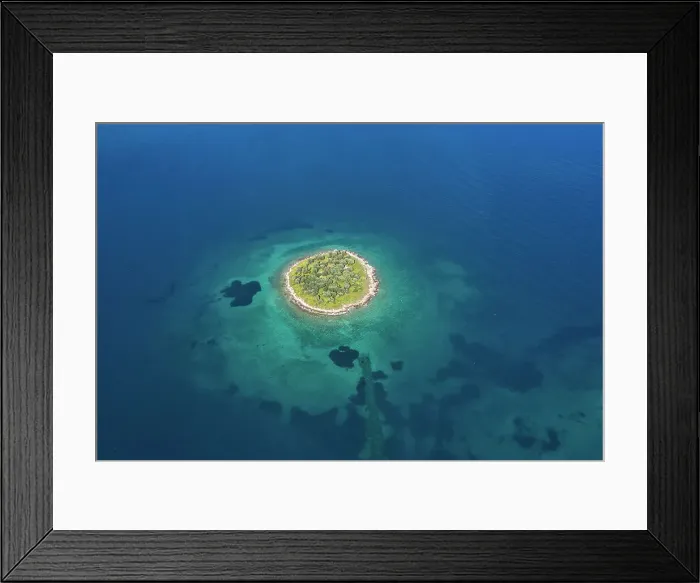 Framed Print : The st. Athanasios island in a blue sea, Greece Framed Print : The st. Athanasios island in a blue sea, Greece