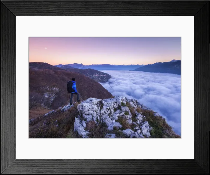 Framed Print : Hiker over the top looks lake Como (ramo di Lecco) covered by the fog at sunrise, Como and Lecco province, Lombardy, Italy (MR) Framed Print : Hiker over the top looks lake Como (ramo di Lecco) covered by the fog at sunrise, Como and Lecco province, Lombardy, Italy (MR)