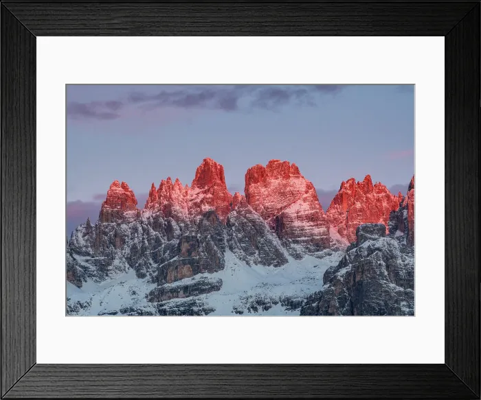Framed Print : The Enrosadira over Brenta Dolomites peaks during a winter sunrise from Paganella, Trentino, Italy
