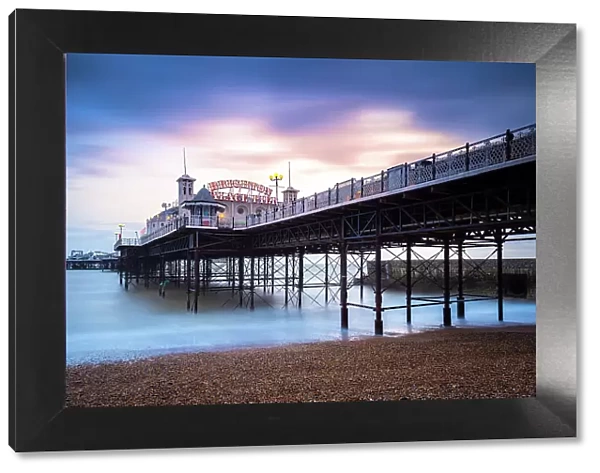 View of the Palace pier at sunset. Brighton, East Sussex, Southern England, United Kingdom