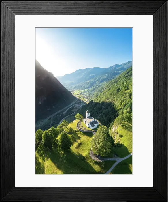 Framed Print : Aerial view of the church of Calonico, dominating Leventina valley towards San Gottardo pass. Calonico, district of Leventina, Canton of Ticino, Switzerland Framed Print : Aerial view of the church of Calonico, dominating Leventina valley towards San Gottardo pass. Calonico, district of Leventina, Canton of Ticino, Switzerland