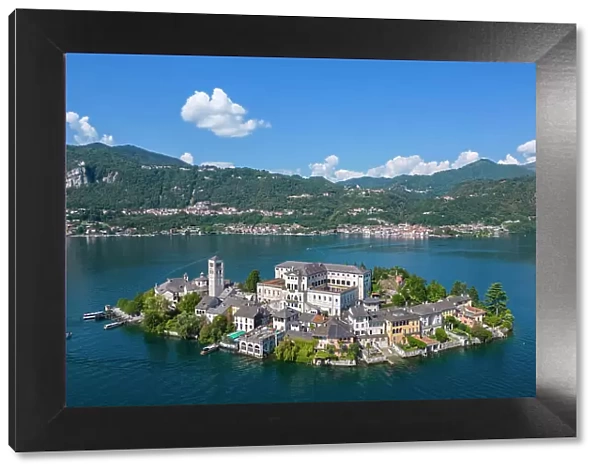 Aerial view of San Giulio island and Lake Orta in the summer. Orta Lake, Province of Novara, Piedmont, Italy