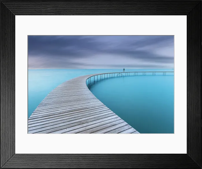 Framed Print : Man admires the sea at dusk on the never ending bridge in Aarhus, central Jutlnd, Aarhus province, South of Denmark, Denmark, Europe