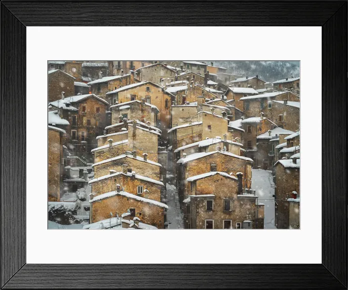 Framed Print : Old houses of the mountain village of Scanno under snowfall, Abruzzo national park, L'aquila province, Abruzzo, Italy