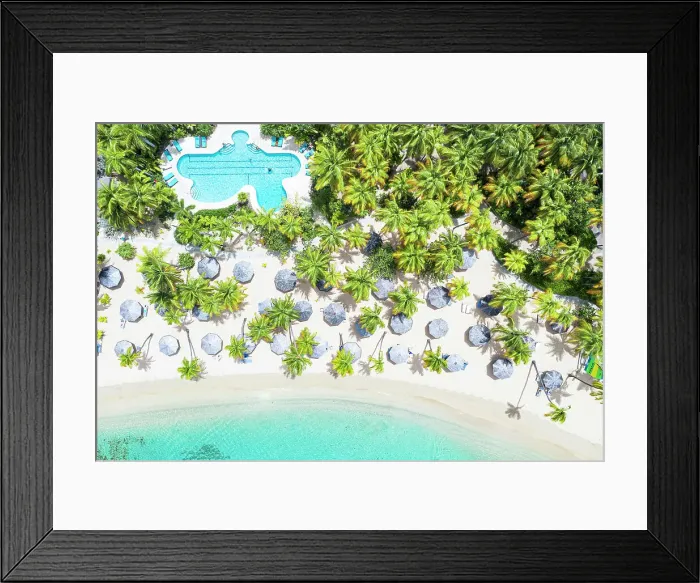 Framed Print : Swimming pool and parasols framed by palm trees on white sand of tropical beach from above, Antigua, Caribbean, West Indies Framed Print : Swimming pool and parasols framed by palm trees on white sand of tropical beach from above, Antigua, Caribbean, West Indies