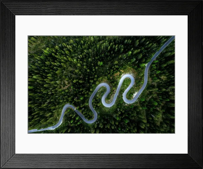 Framed Print : Aerial view of winding mountain road through a forest in spring, Giau Pass, Dolomites, Veneto, Italy Framed Print : Aerial view of winding mountain road through a forest in spring, Giau Pass, Dolomites, Veneto, Italy