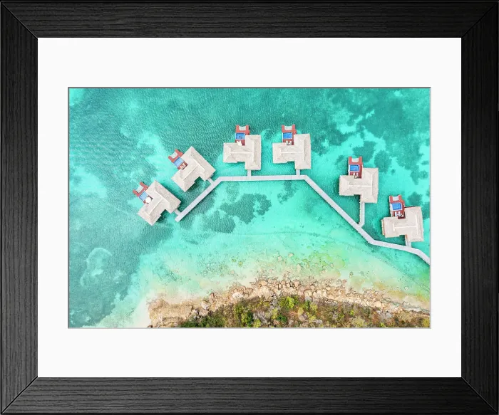 Framed Print : Overhead view of luxury tourist resort with overwater bungalows in the crystal water of Caribbean Sea, Antigua, West Indies Framed Print : Overhead view of luxury tourist resort with overwater bungalows in the crystal water of Caribbean Sea, Antigua, West Indies