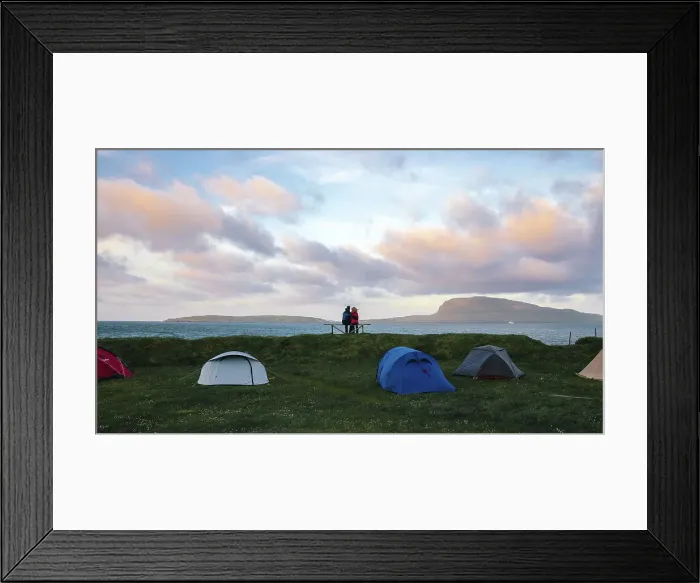 Framed Print : A couple enjoying the sunset in a camping site in Torshavn. In the background the island of Nolsoy Framed Print : A couple enjoying the sunset in a camping site in Torshavn. In the background the island of Nolsoy