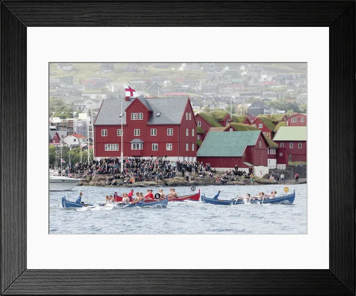 Framed Print : Rowing boats competition in occasion of lavsoka festival in the city of Torshavn. In the background the red buildings of Tinganes. Island of Streymoy. Faroe Islands Framed Print : Rowing boats competition in occasion of lavsoka festival in the city of Torshavn. In the background the red buildings of Tinganes. Island of Streymoy. Faroe Islands