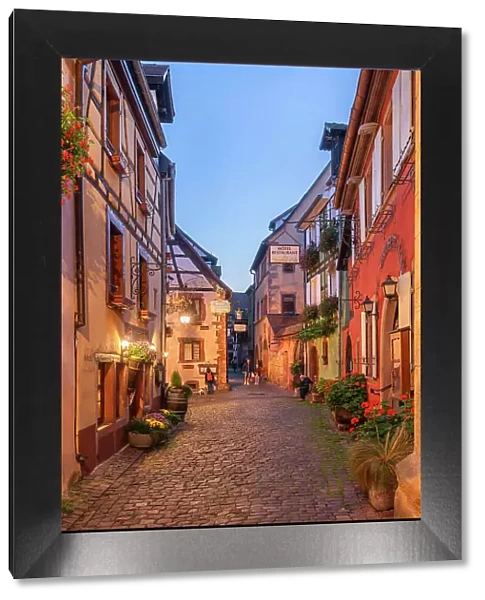 Alley at Riquewihr at dusk, Haut-Rhin, Alsace, Alsace-Champagne-Ardenne-Lorraine, Grand Est, France